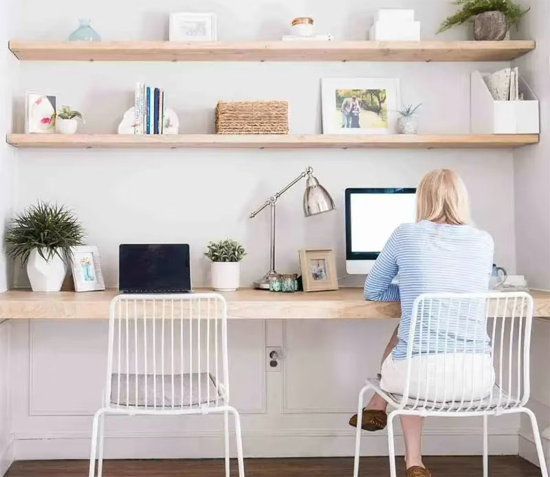 woman using a laptop on a desk