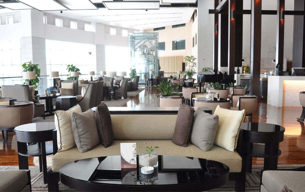 couch with throw pillows at a restaurant lounge