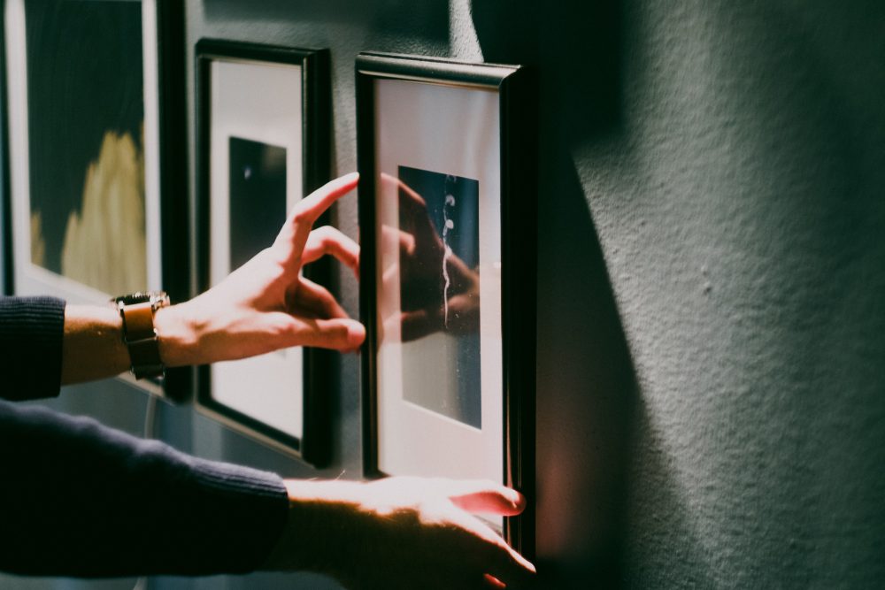 person hanging wall art