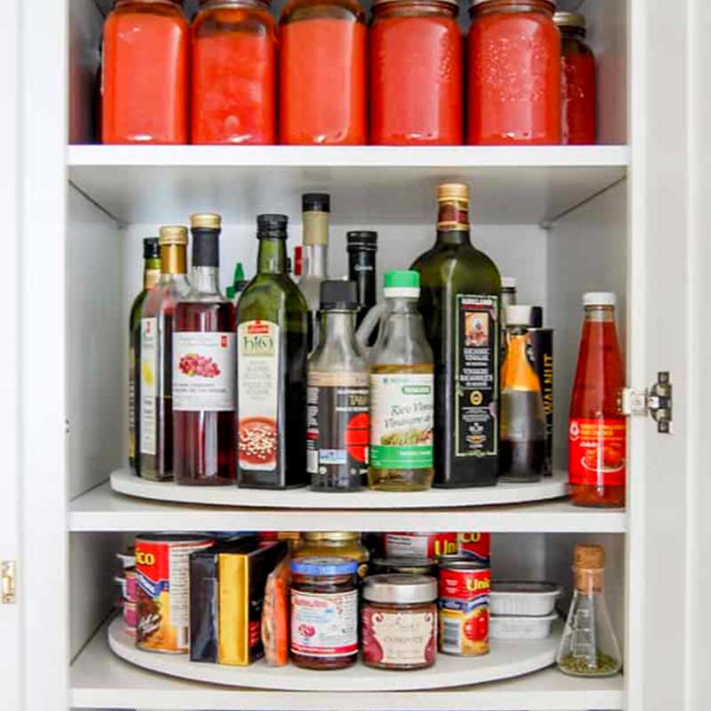 bottles of sauces inside a cabinet