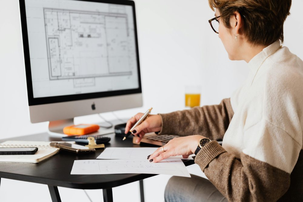 woman creating a floor plan